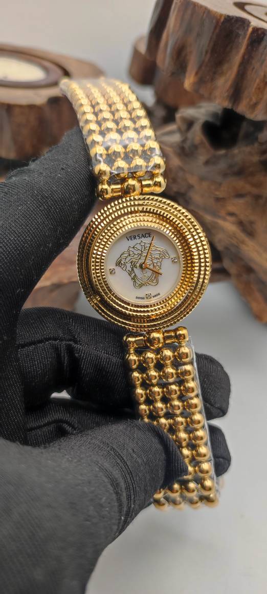 ساعت مچی زنانه صفحه چرخشی طلایی صفحه سفید ورساچه Versace